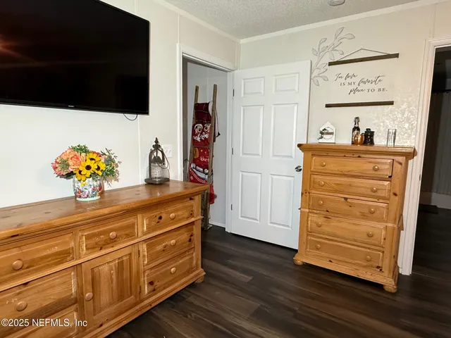 a view of dresser with wooden floor