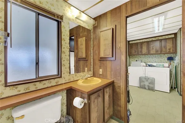 a kitchen with granite countertop a sink and cabinets