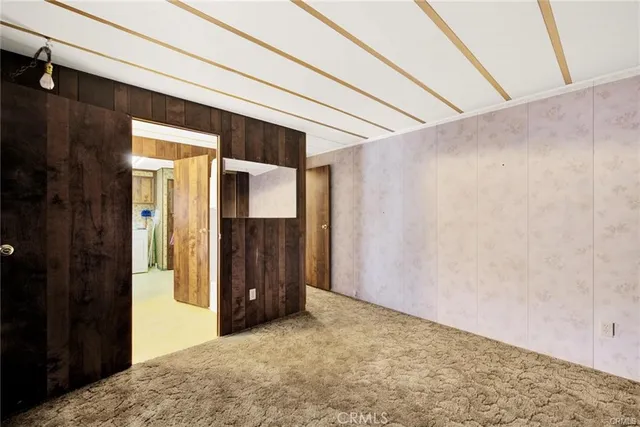 a kitchen with cabinets appliances a sink and a window
