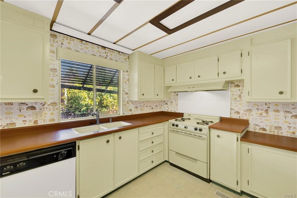 3835 Gardiner Ferry Road, Unit 3 Corning, CA 96021 - Photo 15 of 20 a kitchen with cabinets appliances a sink and a window