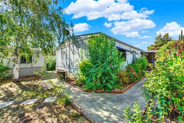 a backyard of a house with lots of green space