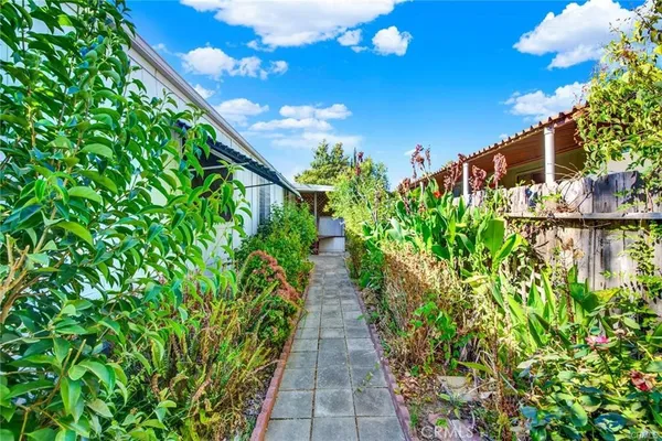a front view of a house with a yard and porch