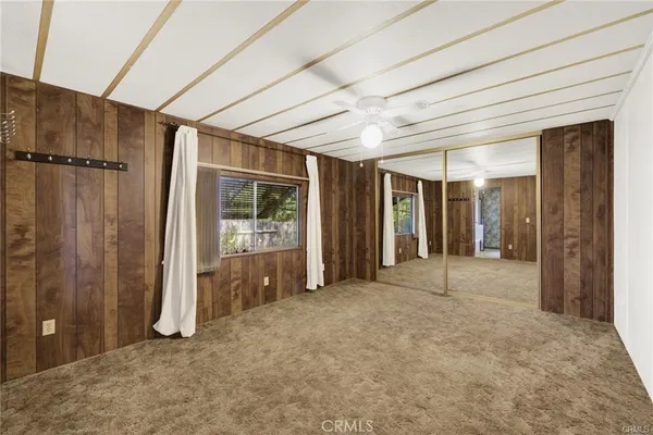 a view of an empty room with a balcony