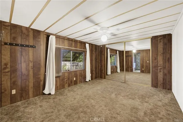 a view of an empty room with a balcony