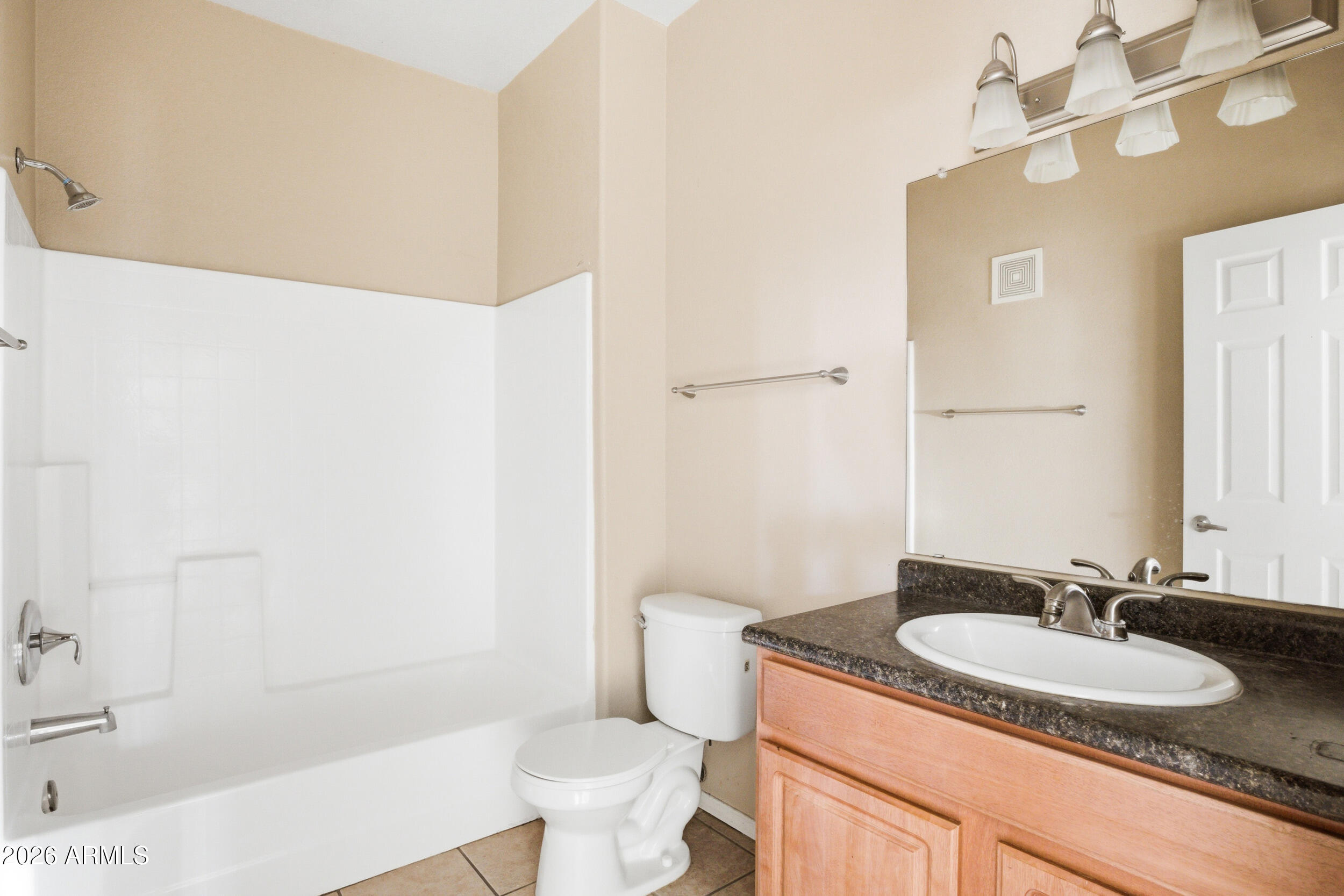 3434 East Baseline Road, Unit 264 Phoenix, AZ 85042 - Photo 10 of 12 a bathroom with a granite countertop sink toilet and shower