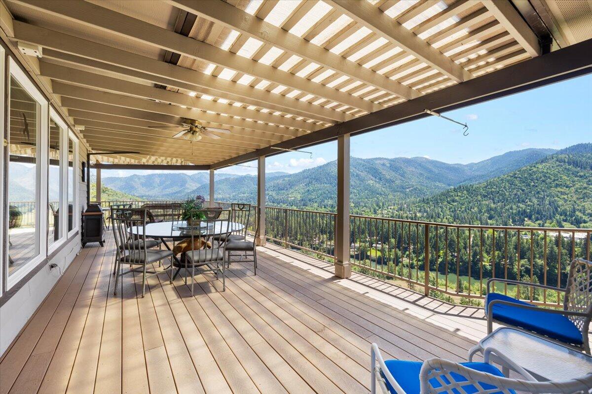 3344 Pearce Park Road Grants Pass, OR 97526 - Photo 20 of 65 Covered deck has fan/lights, water faucet, lots of room for large deck furniture to soak in views.
