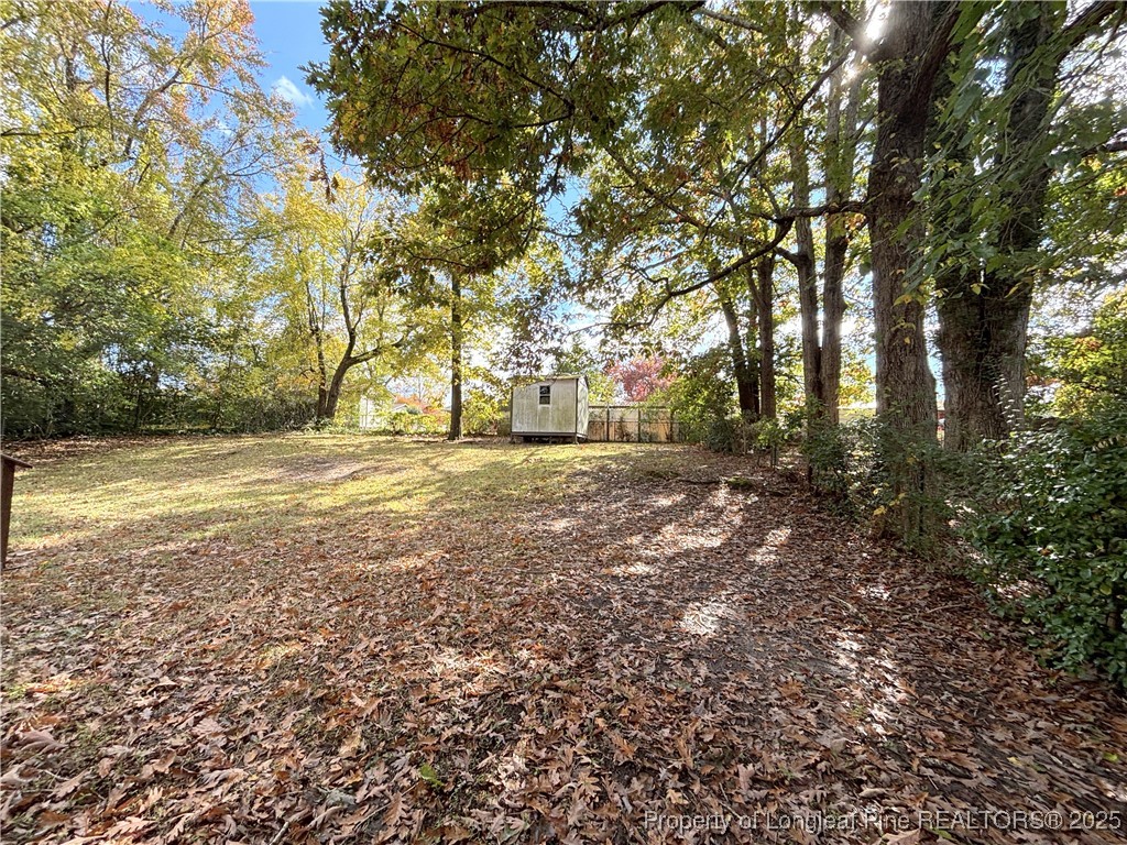 229 Lansdowne Road Fayetteville, NC 28314 - Photo 3 of 18 a view of outdoor space with trees all around