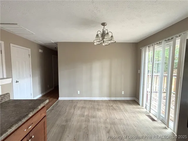 a view of a livingroom with a kitchen