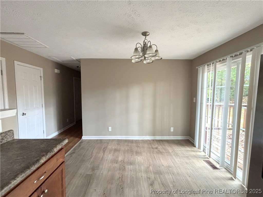 229 Lansdowne Road Fayetteville, NC 28314 - Photo 8 of 18 a view of a livingroom with a kitchen