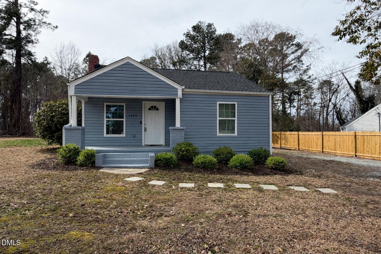 AI-enhanced image to illustrate curb appeal potential. Seller recently installed the front stepping-stone walkway and added landscaping.