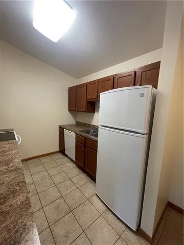 a view of an empty room and a window