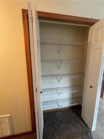 an empty room with staircase