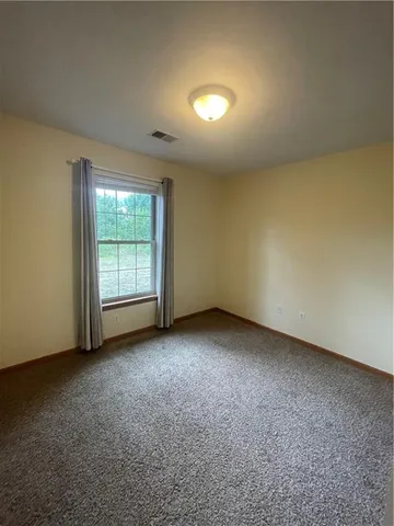 a view of backyard with seating space