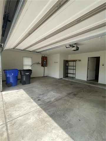 a view of a livingroom with furniture and a kitchen