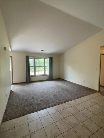 a kitchen with a sink a counter top space and cabinets