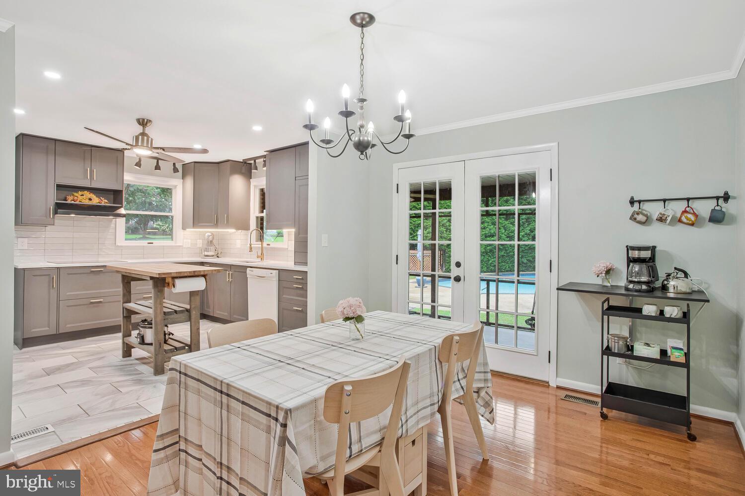1110 Cox Road Huntingtown, MD 20639 - Photo 6 of 20 a view of a dining room with furniture window and wooden floor