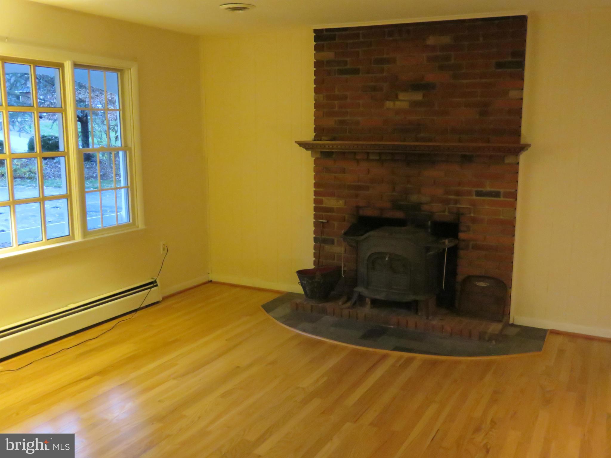 2104 Round Hill Road Fallston, MD 21047 - Photo 4 of 30 Living Room w/Wood Stove