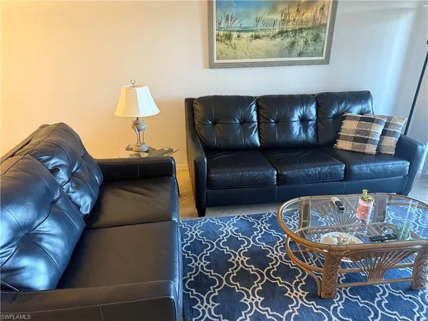 a living room with furniture and a couch