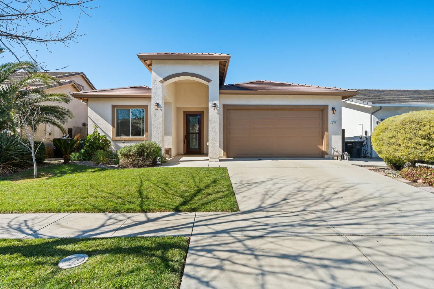 209 Fall Avenue Patterson, CA 95363 - Photo 1 of 48 a front view of a house with garden