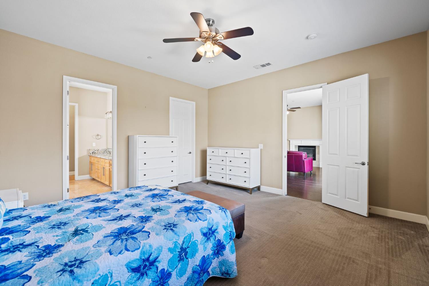 209 Fall Avenue Patterson, CA 95363 - Photo 26 of 48 a bedroom with a bed and a chandelier