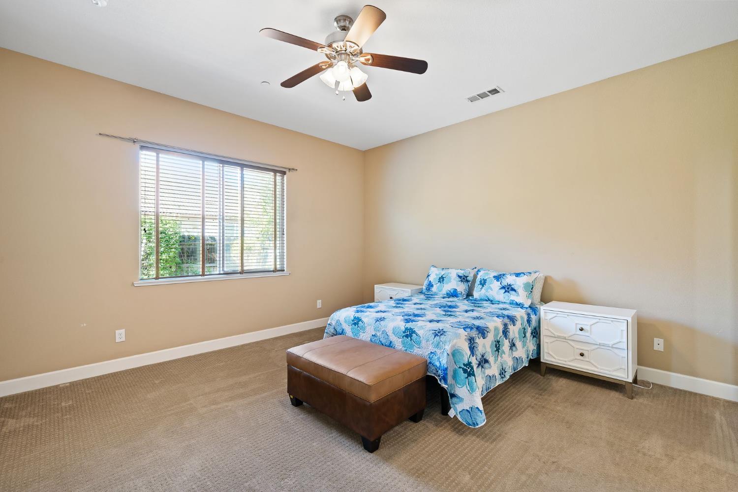 209 Fall Avenue Patterson, CA 95363 - Photo 27 of 48 a bedroom with a bed and a window