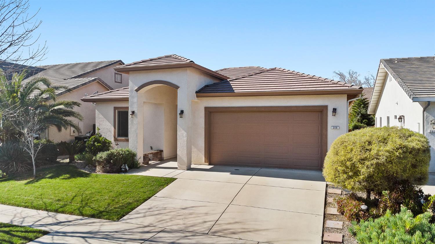 209 Fall Avenue Patterson, CA 95363 - Photo 38 of 48 a front view of a house with garden