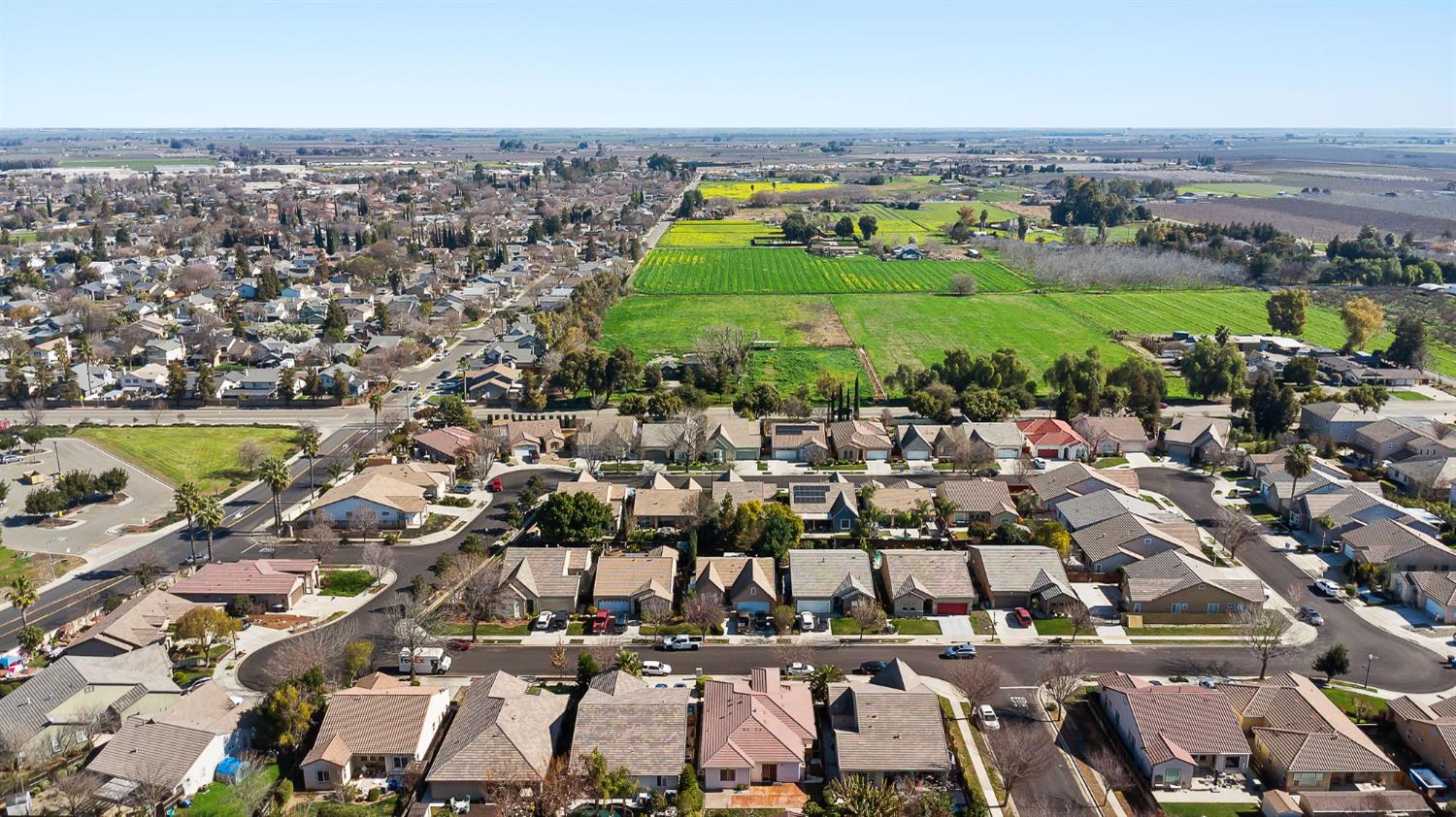 209 Fall Avenue Patterson, CA 95363 - Photo 45 of 48 an aerial view of a city with lots of residential buildings