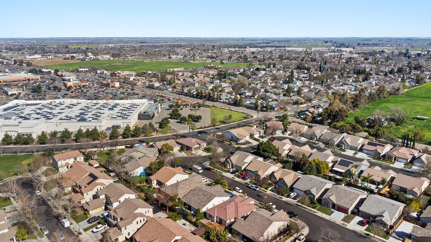 209 Fall Avenue Patterson, CA 95363 - Photo 46 of 48 an aerial view of a city with lots of residential buildings