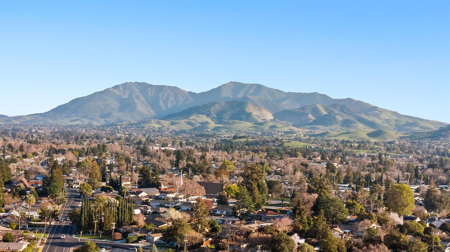 209 Fall Avenue Patterson, CA 95363 - Photo 48 of 48 an aerial view of residential house and mountains in the background