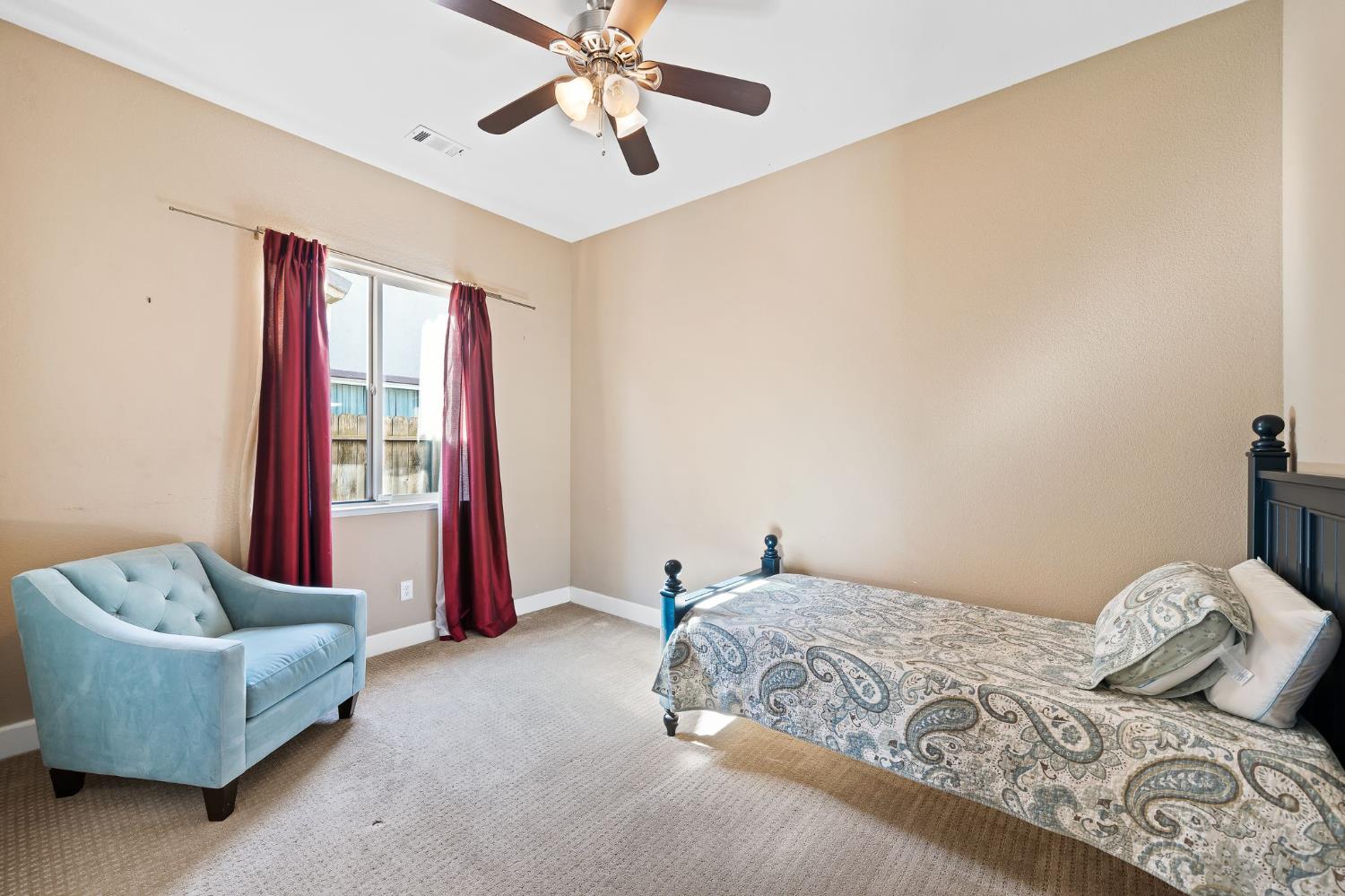 209 Fall Avenue Patterson, CA 95363 - Photo 9 of 48 a bedroom with a bed and couch