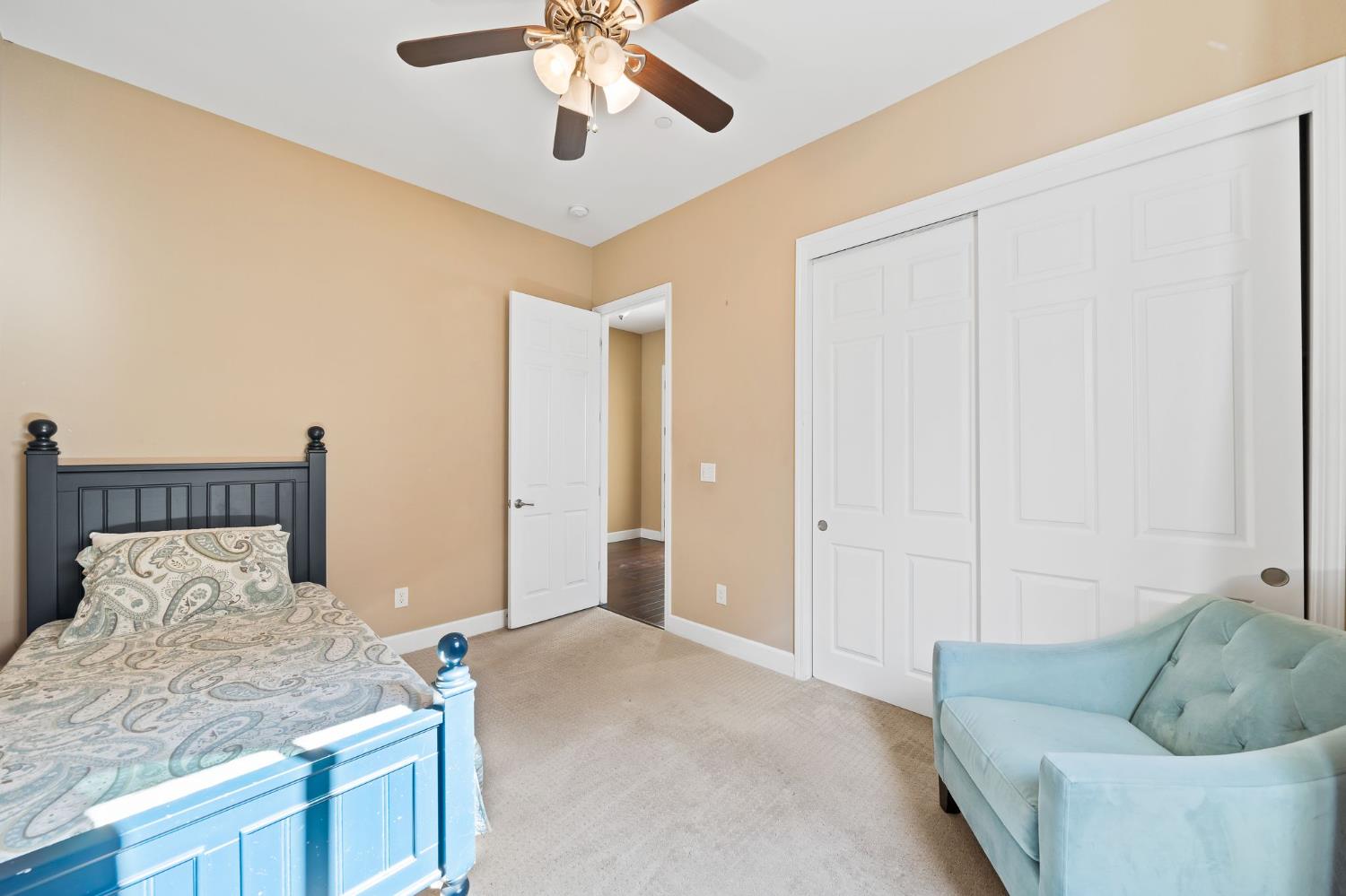 209 Fall Avenue Patterson, CA 95363 - Photo 10 of 48 a bed room with a bed and a couch