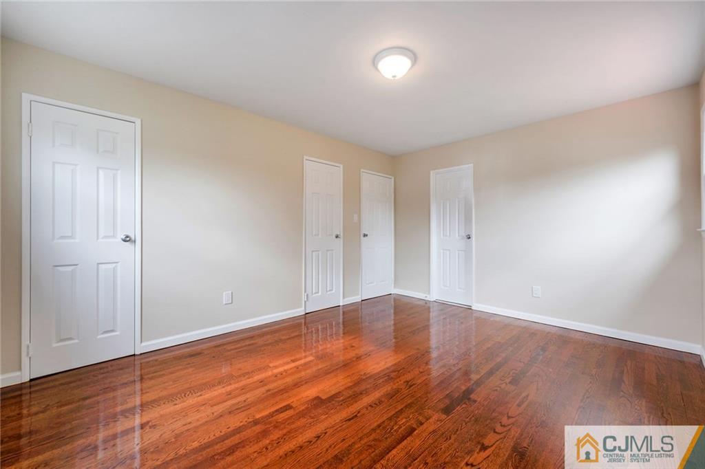 13 Barton Road Old Bridge, NJ 08857 - Photo 15 of 24 a view of an empty room with wooden floor
