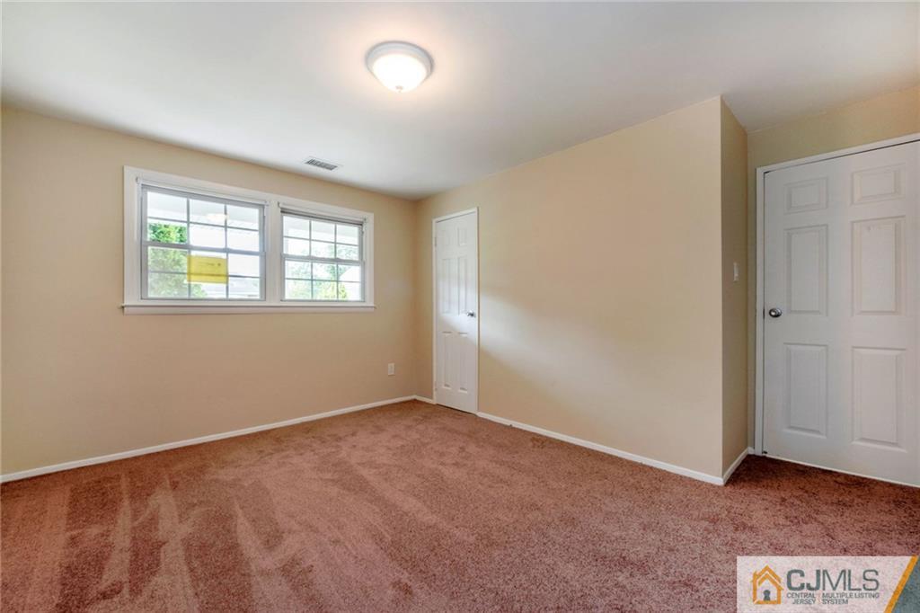 13 Barton Road Old Bridge, NJ 08857 - Photo 16 of 24 an empty room with windows