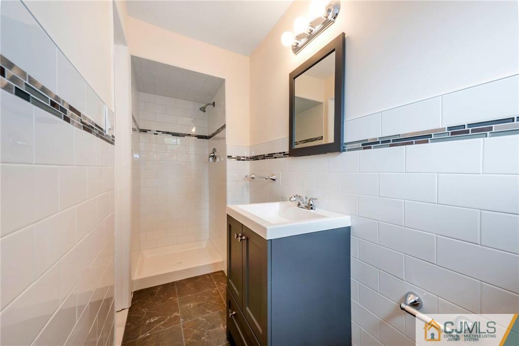 13 Barton Road Old Bridge, NJ 08857 - Photo 19 of 24 a bathroom with a sink and a mirror