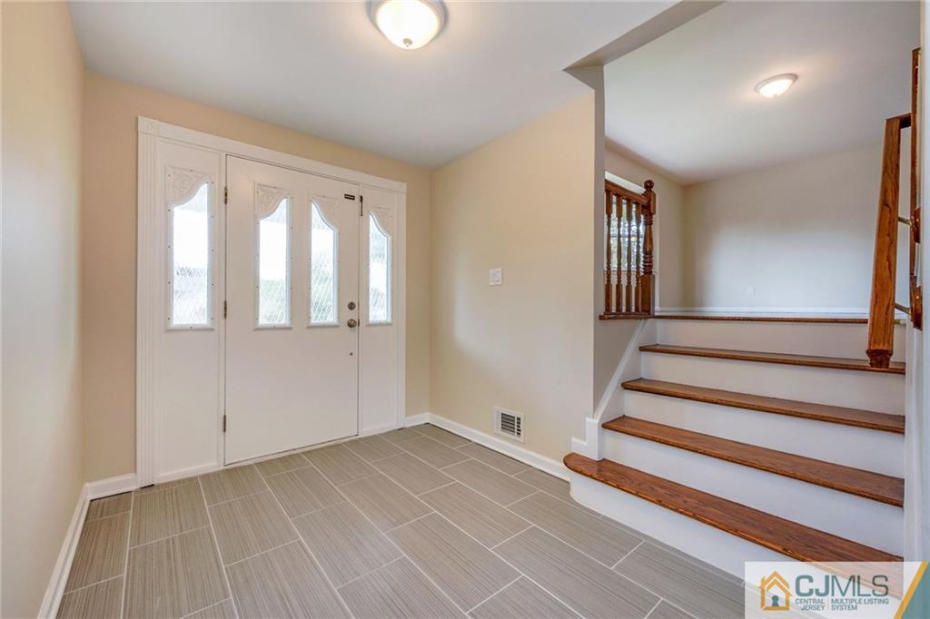 13 Barton Road Old Bridge, NJ 08857 - Photo 5 of 24 a view of an empty room with stairs