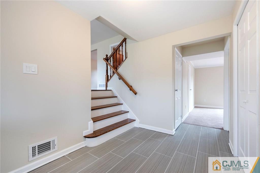 13 Barton Road Old Bridge, NJ 08857 - Photo 6 of 24 a view of entryway with wooden floor