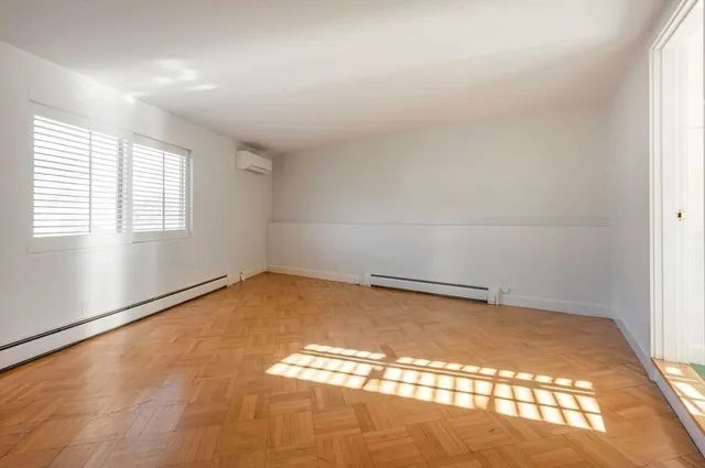 a view of an empty room and window