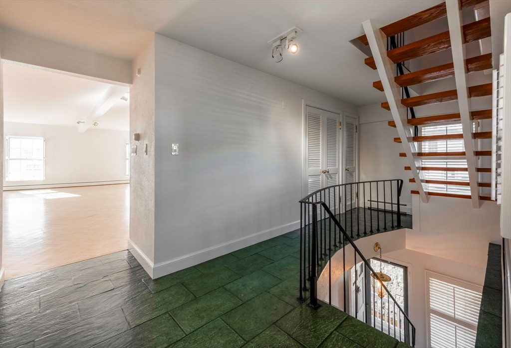 21 Central Street, Unit 1 Manchester, MA 01944 - Photo 19 of 24 a view of entryway with wooden floor