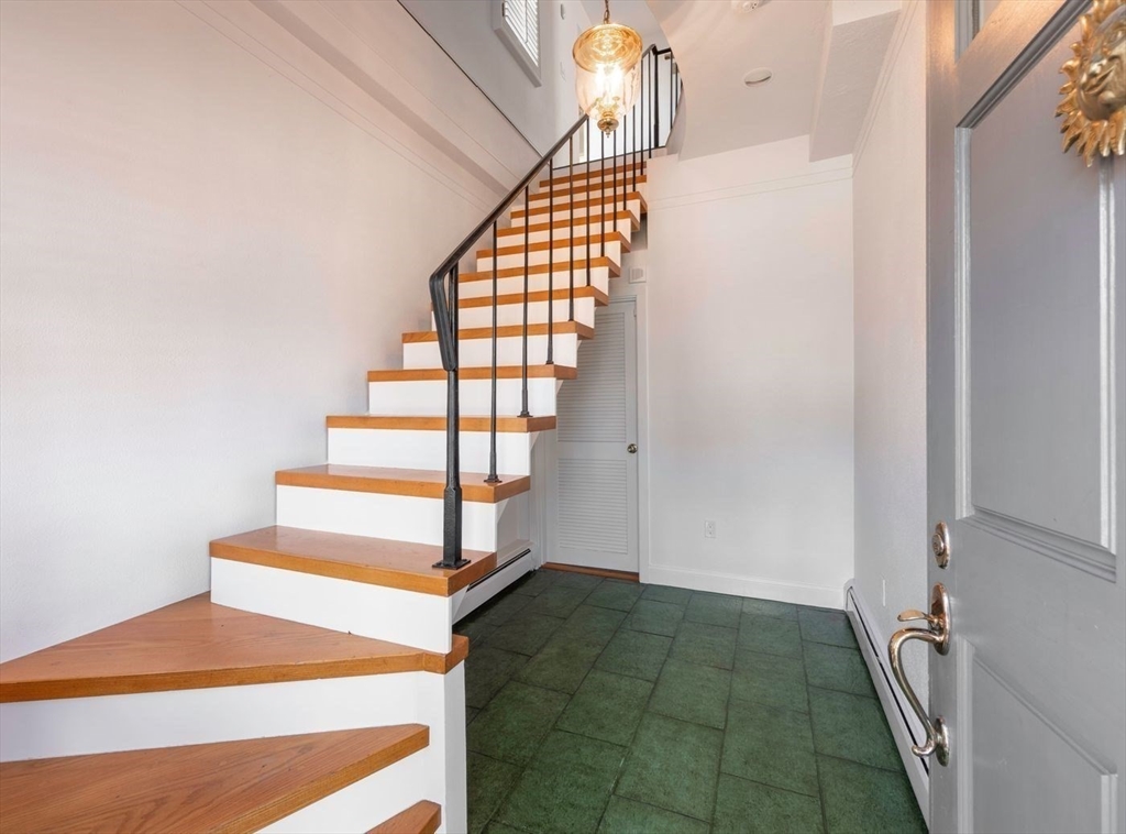 21 Central Street, Unit 1 Manchester, MA 01944 - Photo 21 of 24 a view of entryway with wooden floor