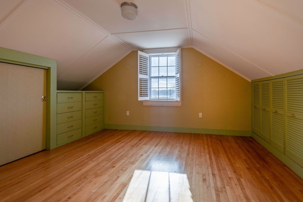 21 Central Street, Unit 1 Manchester, MA 01944 - Photo 23 of 24 an empty room with wooden floor and windows