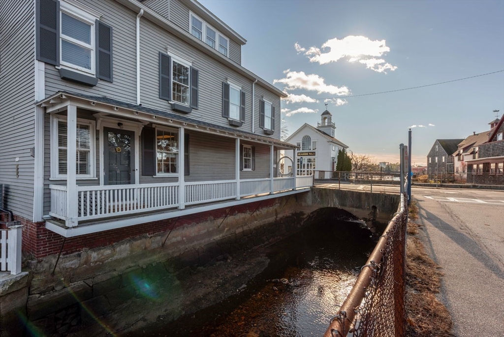 21 Central Street, Unit 1 Manchester, MA 01944 - Photo 4 of 24 a view of a house with swimming pool