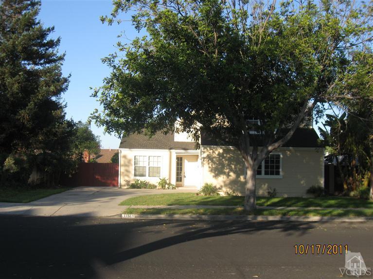 1151 Rivas Lane Oxnard, CA 93035 - Photo 1 of 11 a front view of a house with a yard and garage