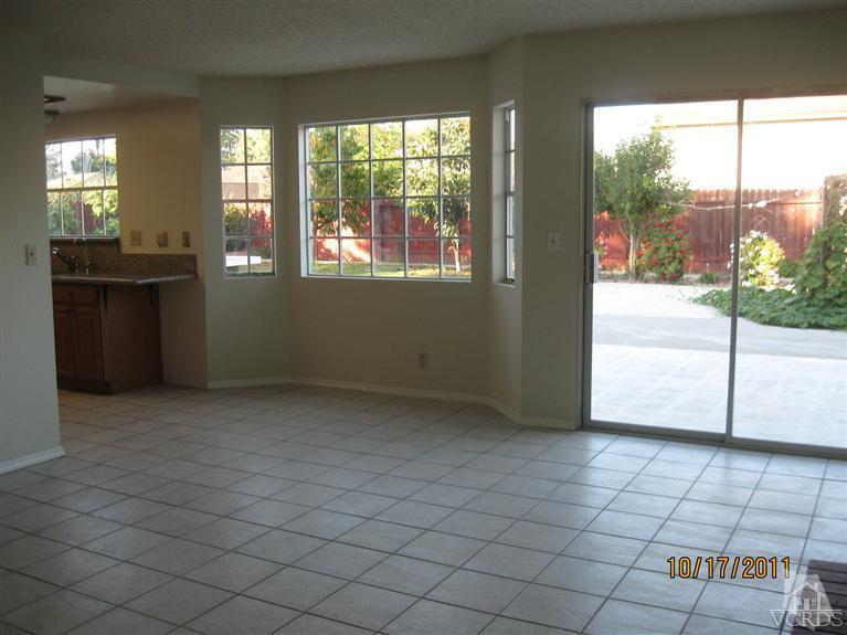 1151 Rivas Lane Oxnard, CA 93035 - Photo 3 of 11 a view of a kitchen with a sink and a stove top oven
