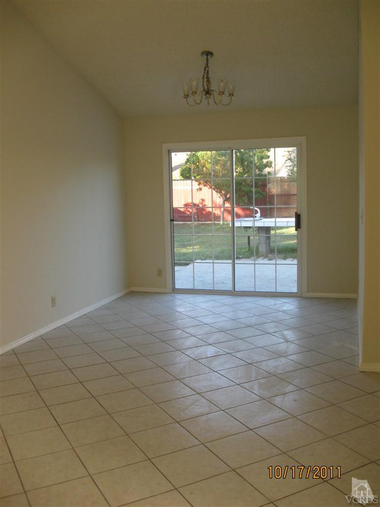 1151 Rivas Lane Oxnard, CA 93035 - Photo 5 of 11 a view of a room with wooden floor and windows