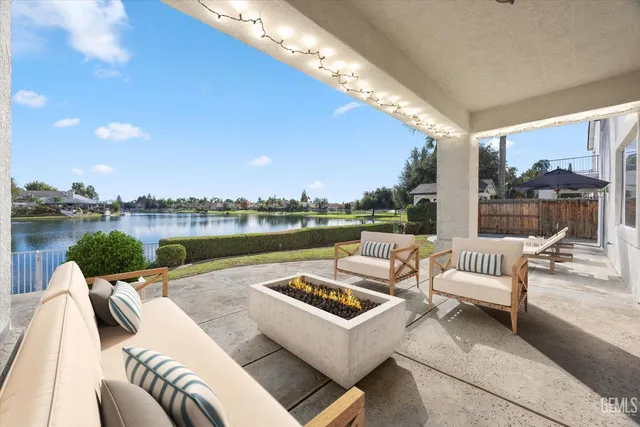 a view of a terrace with couches and pool