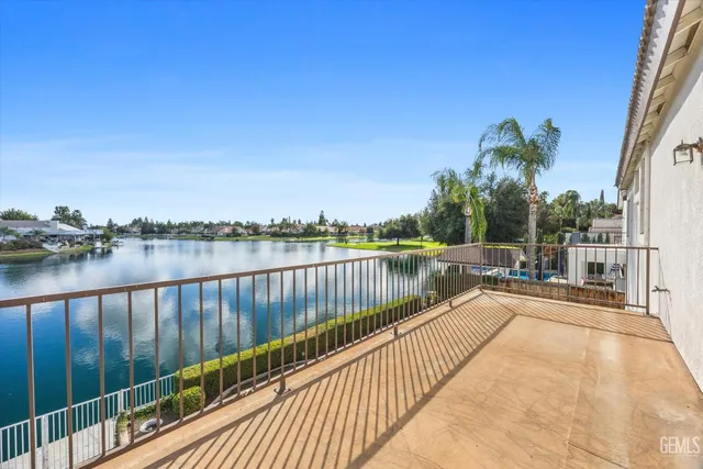 a view of a lake with houses in the background