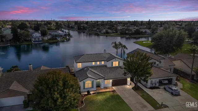 an aerial view of house with lake view