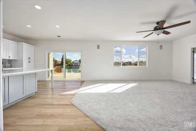 a bathroom with a double vanity sink toilet mirror and shower