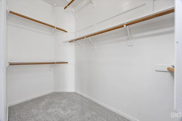 a picture of a wall with a white building