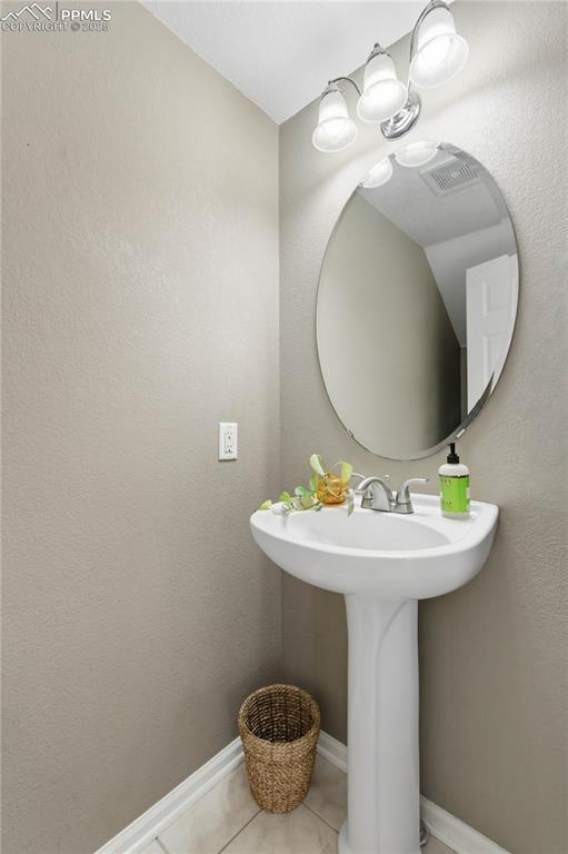 14320 Woodrock Path Colorado Springs, CO 80921 - Photo 17 of 38 Half bath on main floor